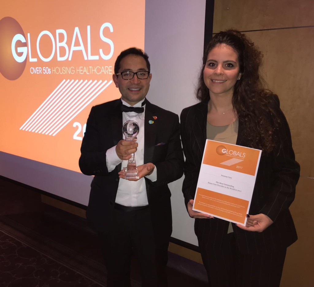 Penrose Care Managing Director Robert Stephenson-Padron and senior care worker Nikoletta Makouli following Penrose Care being named the Most Outstanding Home Care Provider in the World.