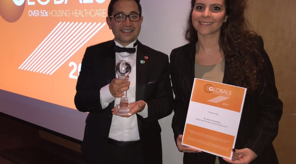 Penrose Care Managing Director Robert Stephenson-Padron and senior care worker Nikoletta Makouli following Penrose Care being named the Most Outstanding Home Care Provider in the World.